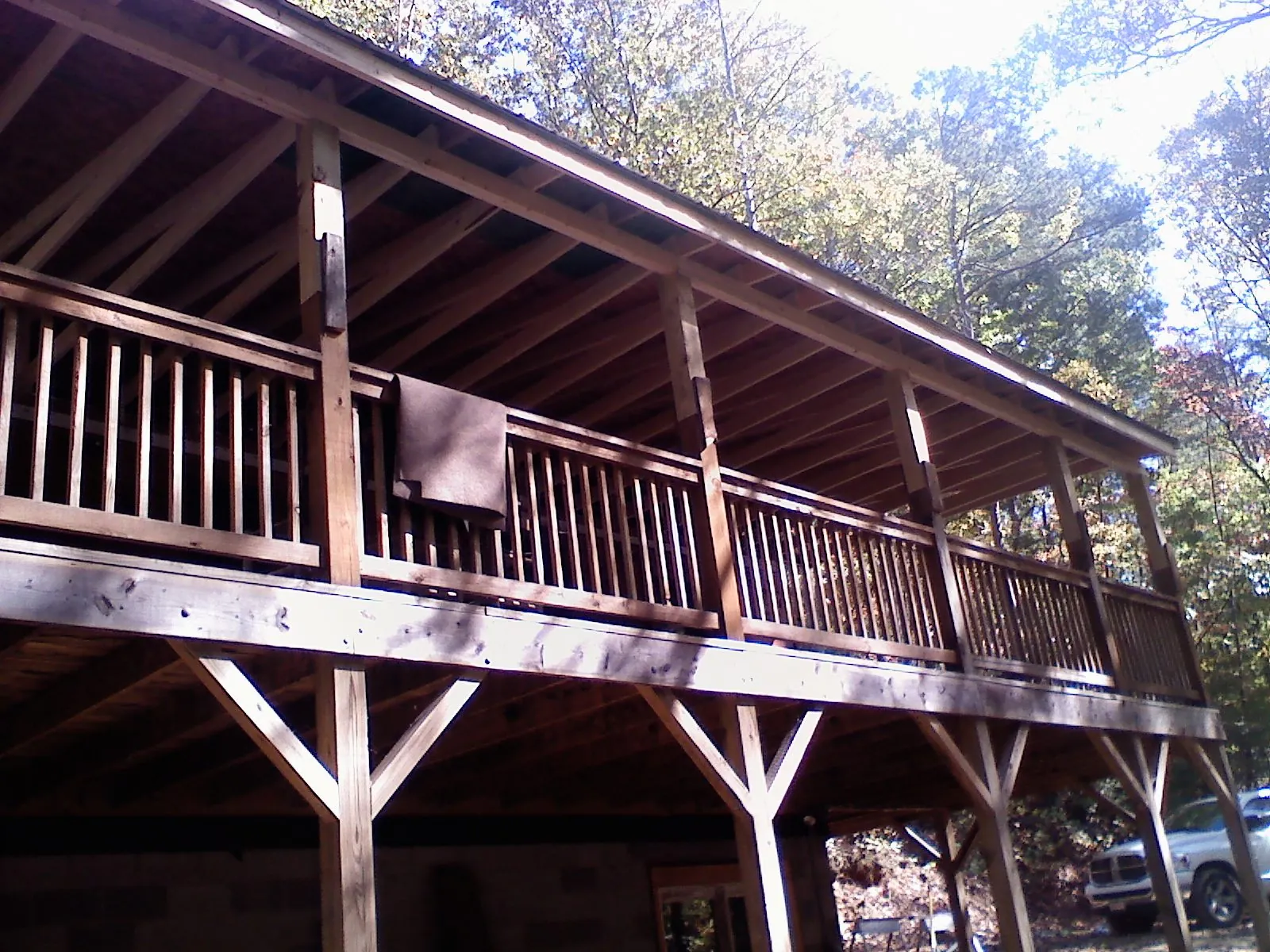Timber framing under a new elevated porch and deck — Roof Leak Repair in South Plymouth by Roofing Brothers